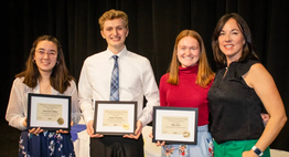 three early college students with their coordinator and awards
